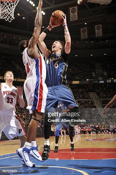 Mike Miller of the Washington Wizards battles to shoot over Jason Maxiell of the Detroit Pistons during the game on March 12, 2010 at The Palace of...