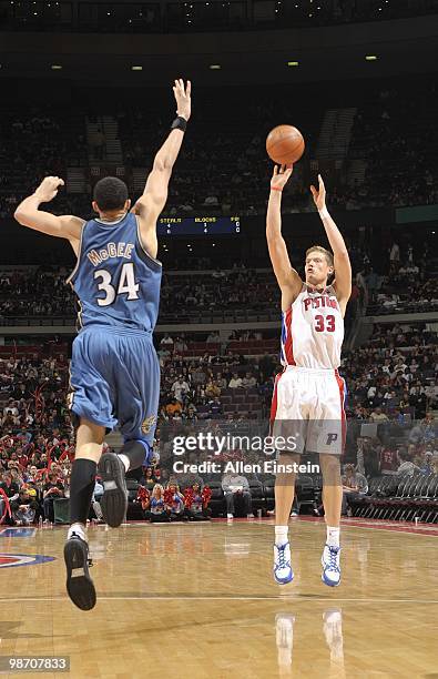 Jonas Jerebko of the Detroit Pistons shoots over JaVale McGee of the Washington Wizards on March 12, 2010 at The Palace of Auburn Hills in Auburn...