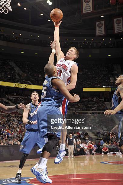 Jonas Jerebko of the Detroit Pistons hooks a shot over Randy Foye of the Washington Wizards on March 12, 2010 at The Palace of Auburn Hills in Auburn...