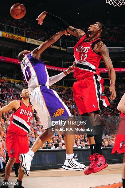 LaMarcus Aldridge of the Portland Trail Blazers passes the ball against Leandro Barbosa of the Phoenix Suns in Game Two of the Western Conference...