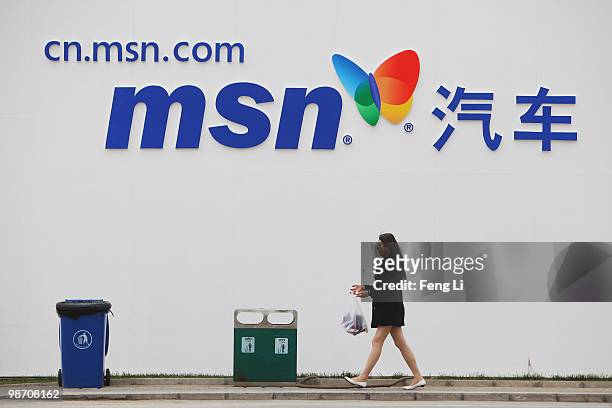 Model walks in front of a banner of MSN during the Beijing Auto Show on April 27, 2010 in Beijing of China. Major global automakers plan to unveil...
