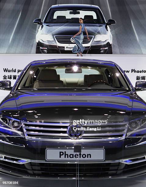 Model stands behind the world premiere display of Volkswagen new Phaeton during the Beijing Auto Show on April 27, 2010 in Beijing of China. Major...