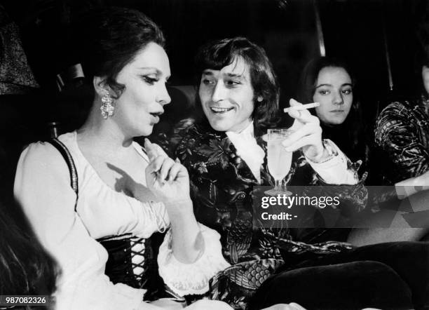 File photo taken 09 February 1971 in Madrid shows Spanish dancer and choreographer Antonio Gades chatting during a party with Italian actress Gina...