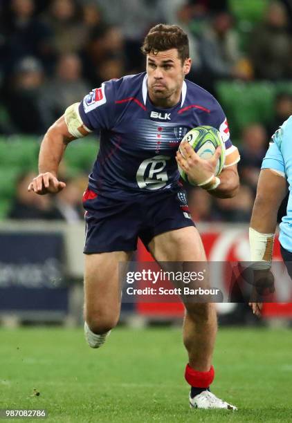 Tom English of the Rebels runs with the ball during the round 17 Super Rugby match between the Rebels and the Waratahs at AAMI Park on June 29, 2018...