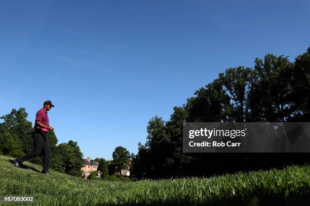 Tiger Woods walks to the 12th fairway during the second round of the Quicken Loans National at TPC Potomac on June 29, 2018 in Potomac, Maryland.