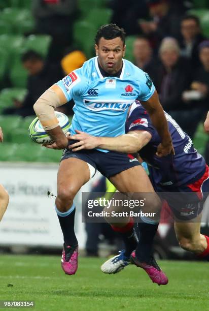 Kurtley Beale of the Waratahs runs with the ball during the round 17 Super Rugby match between the Rebels and the Waratahs at AAMI Park on June 29,...