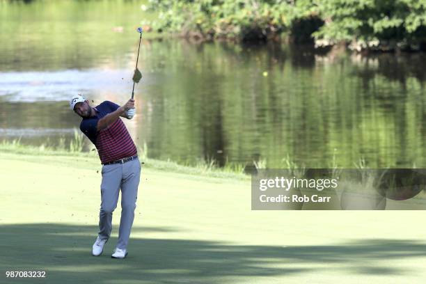 Marc Leishman of Australia plays a shot on the 13th hole during the second round of the Quicken Loans National at TPC Potomac on June 29, 2018 in...