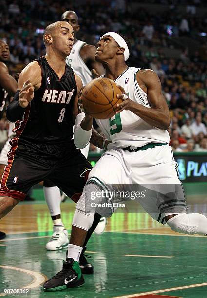 Rajon Rondo of the Boston Celtics heads for the net as Carlos Arroyo of the Miami Heat defends during Game Five of the Eastern Conference...