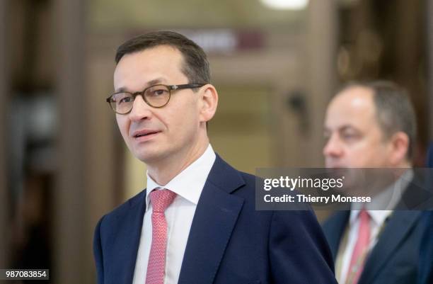 Polish Prime Minister Mateusz Morawiecki talks to the media at the end of an EU Summit at European Council on June 29, 2018 in Brussels, Belgium. He...