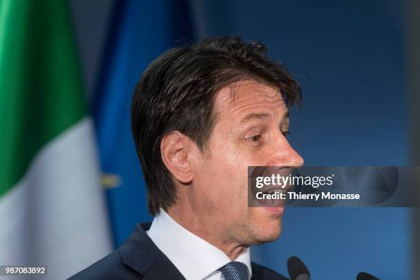 Italy's prime minister Giuseppe Conte talks to the media at the end of an EU Summit at European Council on June 29, 2018 in Brussels, Belgium.