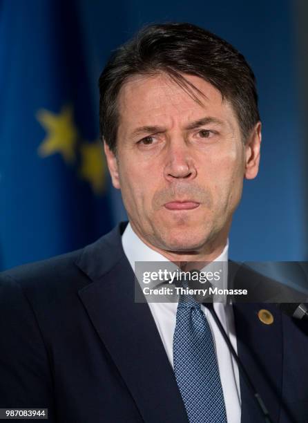 Italy's prime minister Giuseppe Conte talks to the media at the end of an EU Summit at European Council on June 29, 2018 in Brussels, Belgium.