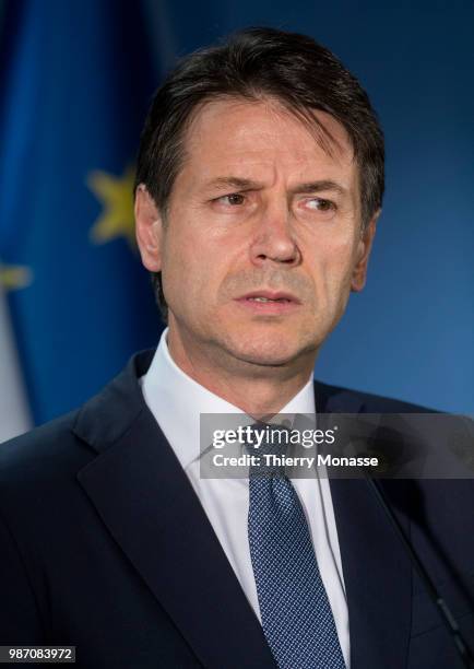 Italy's prime minister Giuseppe Conte talks to the media at the end of an EU Summit at European Council on June 29, 2018 in Brussels, Belgium.