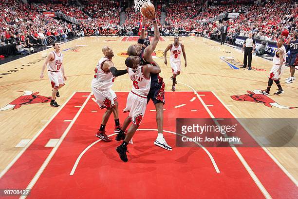 Antawn Jamison of the Cleveland Cavaliers puts a shot up against Ronald Murray of the Chicago Bulls during Game Three of the Eastern Conference...