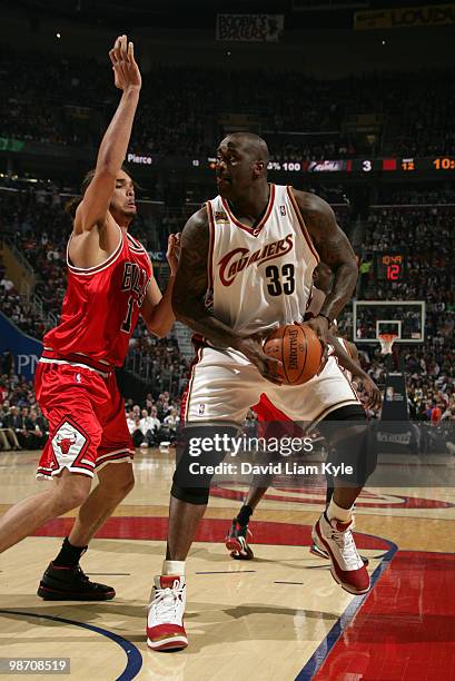 Shaquille O'Neal of the Cleveland Cavaliers pushes the ball into the paint against Joakim Noah of the Chicago Bulls in Game Five of the Eastern...