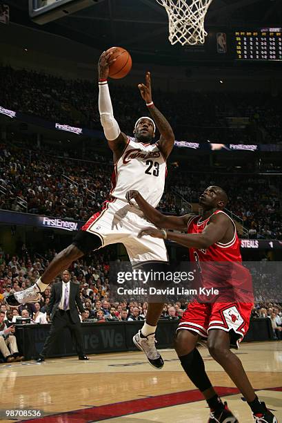 LeBron James of the Cleveland Cavaliers goes up for the shot against Luol Deng of the Chicago Bulls in Game Five of the Eastern Conference...