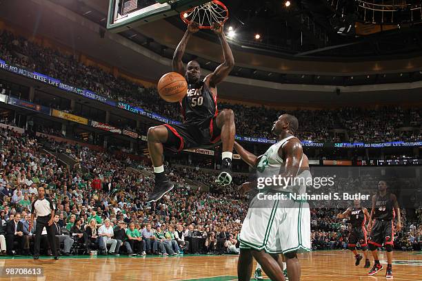 Joel Anthony of the Miami Heat dunks against Kendrick Perkins of the Boston Celtics in Game Five of the Eastern Conference Quarterfinals during the...