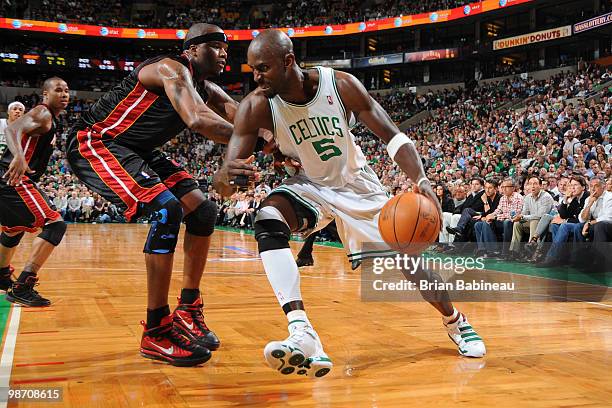 Kevin Garnett of the Boston Celtics drives to the basket against Jermaine O'Neal of the Miami Heat in Game Five of the Eastern Conference...