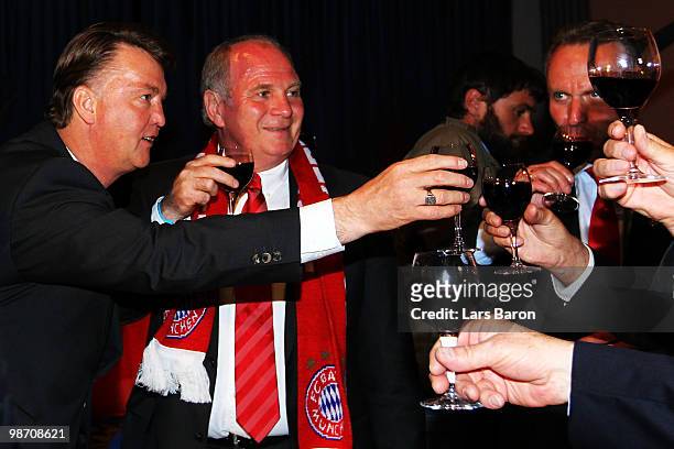 Head coach Louis van Gaal of Muenchen drinks a glass of red vine next to president Uli Hoeness and CEO Karl Heinz Rummenigge at the Champions League...