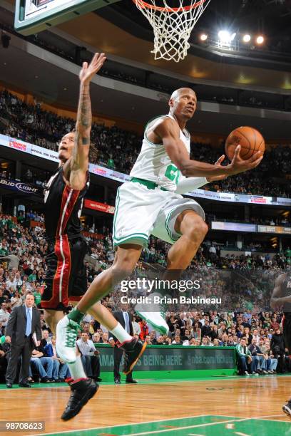 Ray Allen of the Boston Celtics goes up for the reverse layup against Michael Beasley of the Miami Heat in Game Five of the Eastern Conference...