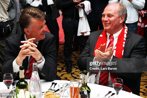 Head coach Louis van Gaal of Muenchen smiles with president Uli Hoeness at the Champions League dinner after reaching the final following their 3-0...