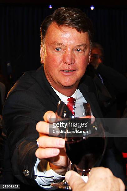 Head coach Louis van Gaal drinks a glass of red vine at the Champions League dinner after reaching the final following their 3-0 victory of the UEFA...