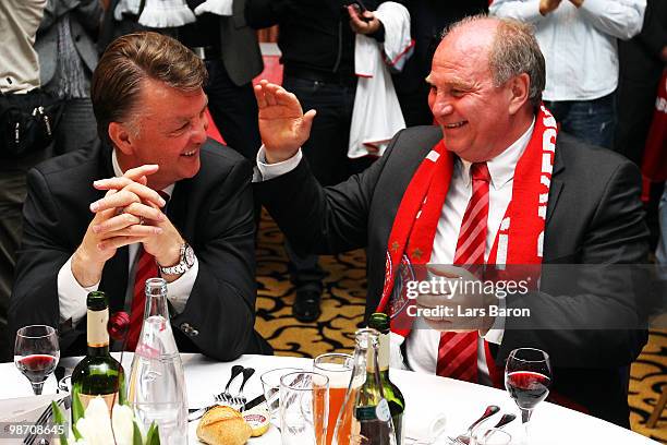 Head coach Louis van Gaal of Muenchen smiles with president Uli Hoeness at the Champions League dinner after reaching the final following their 3-0...