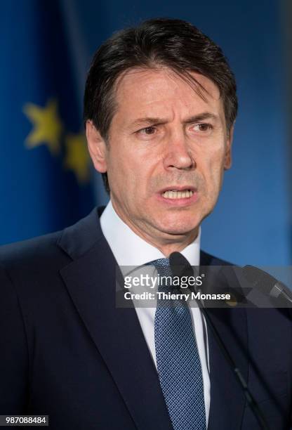 Italy's prime minister Giuseppe Conte talks to the media at the end of an EU Summit at European Council on June 29, 2018 in Brussels, Belgium.