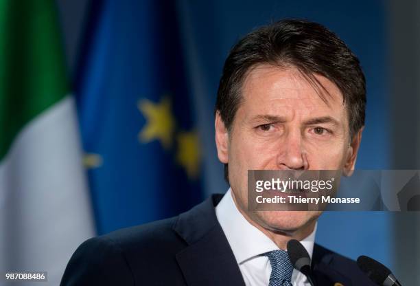 Italy's prime minister Giuseppe Conte talks to the media at the end of an EU Summit at European Council on June 29, 2018 in Brussels, Belgium.
