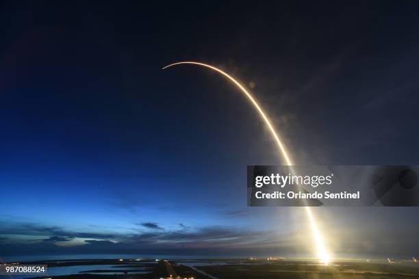 SpaceX Falcon 9 rocket launched just before dawn Friday, June 29, 2018 is captured during a time exposure at Launch Complex 40 at Cape Canaveral Air...