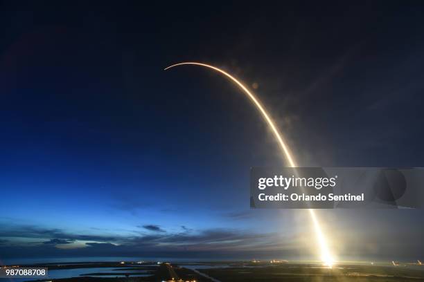 SpaceX Falcon 9 rocket launched just before dawn Friday, June 29, 2018 is captured during a time exposure at Launch Complex 40 at Cape Canaveral Air...