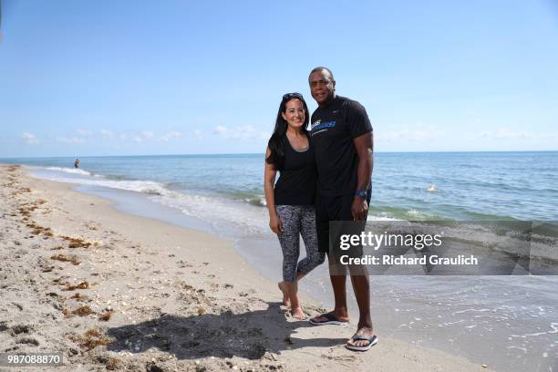 Where Are They Now: Portrait of former NFL running back and sports broadcaster Ahmad Rashad posing with his wife Ana during photo shoot on beach....