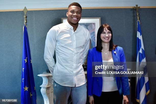 All-Star and Milwaukee Bucks forward Giannis Antetokounmpo and Greek Tourism Minister Elena Kountoura pose for a picture during a press conference to...