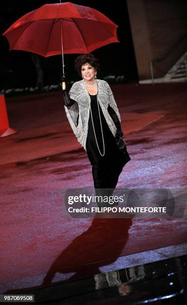 Italian actress Gina Lollobrigida arrives on the red carpet to present the documentary, "Gina Lollobrigida, Un simbolo italiano nel mondo" at the...