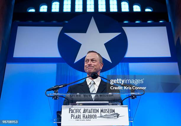 Gary Sinise speaks during the Pacific Aviation Museum Gala to honor Senate Appropriations Chairman Daniel Inouye at National Building Museum on April...