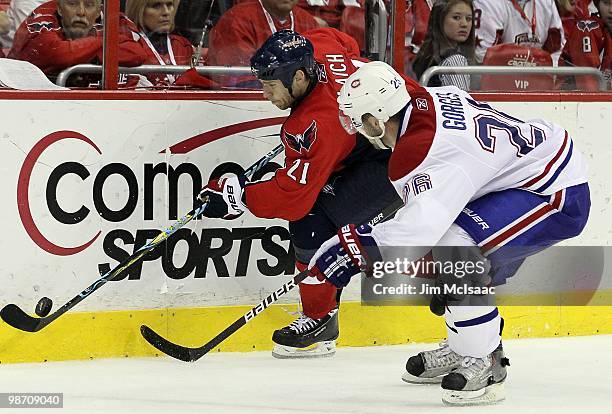 Josh Gorges of the Montreal Canadiens defends against Brooks Laich of the Washington Capitals in Game Five of the Eastern Conference Quarterfinals...