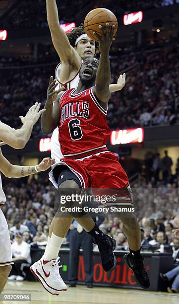 Ronald Murray of the Chicago Bulls tries to get a shot off against Anderson Varejao of the Cleveland Cavaliers in Game Five of the Eastern Conference...