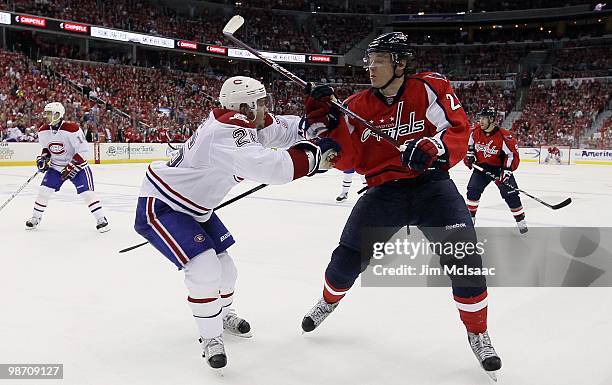 Josh Gorges of the Montreal Canadiens defends against Alexander Semin of the Washington Capitals in Game Five of the Eastern Conference Quarterfinals...