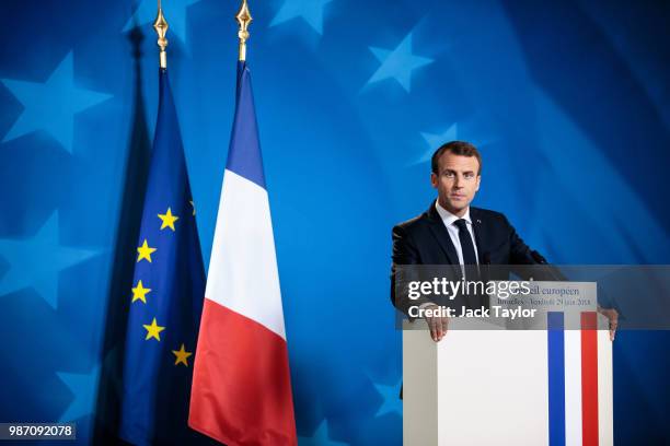 French President Emmanuel Macron holds a press conference on the final day of the European Council leaders' summit on June 29, 2018 in Brussels,...