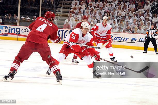 Zbynek Michalek of the Phoenix Coyotes gets the puck over the stick of Valtteri Filppula of the Detroit Red Wings in Game Seven of the Western...