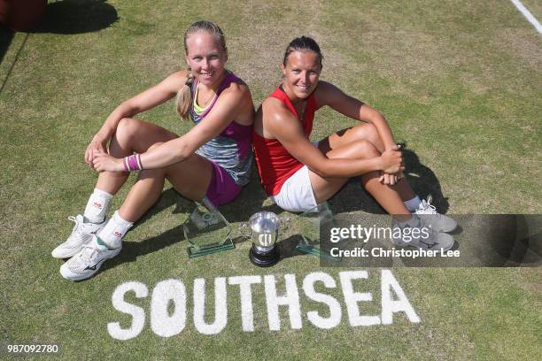 Kirsten Flipkens of Belgium and Johanna Larsson of Sweden pose for the camera with the Doubles Winners Trophies after they beat Alicja Rosolska of...