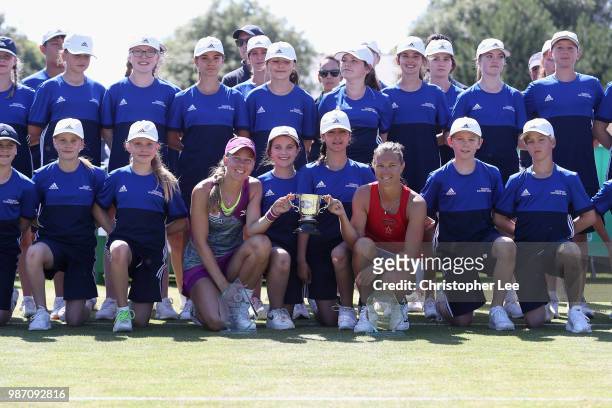 Kirsten Flipkens of Belgium and Johanna Larsson of Sweden pose for the camera with the Doubles Winners Trophies after they beat Alicja Rosolska of...