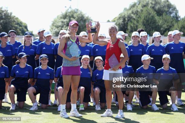 Kirsten Flipkens of Belgium and Johanna Larsson of Sweden pose for the camera with the Doubles Winners Trophies after they beat Alicja Rosolska of...