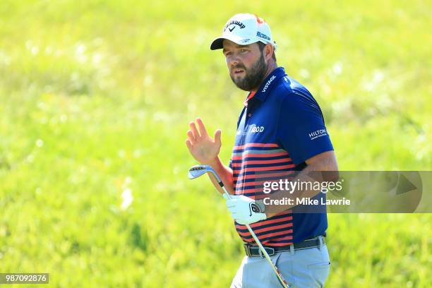 Marc Leishman of Australia reacts after a shot on to the 14th green during the second round of the Quicken Loans National at TPC Potomac on June 29,...