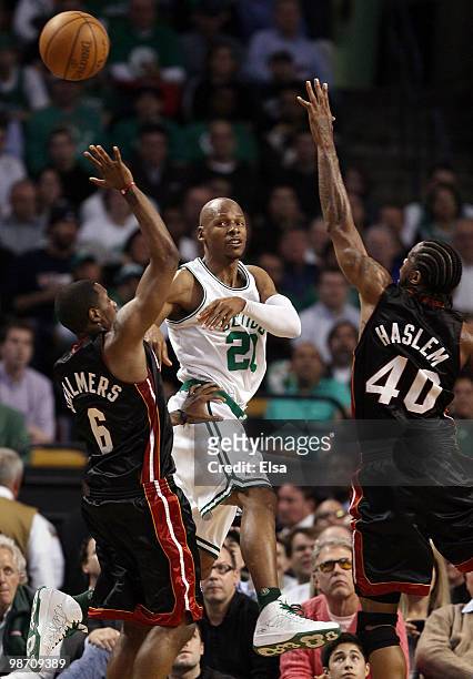 Ray Allen of the Boston Celtics passes the ball under pressure from Mario Chalmers and Udonis Haslem of the Miami Heat during Game Five of the...