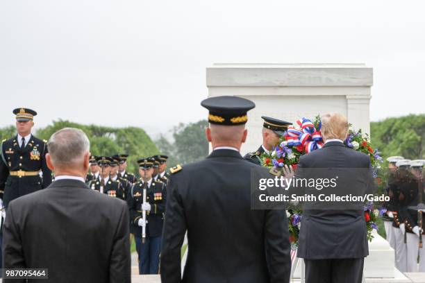 President Donald J Trump lays a wreath at the Tomb of the Unknown Soldier accompanied by Secretary of Defense James N Mattis and Chairman of the...