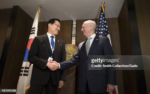 Secretary of Defense James N Mattis shaking hands with Republic of Korea Minister of National Defense Song Young-moo at the Shangri-La Dialogue,...