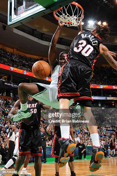 Kendrick Perkins of the Boston Celtics dunks the ball against Michael Beasley of the Miami Heat in Game Five of the Eastern Conference Quarterfinals...