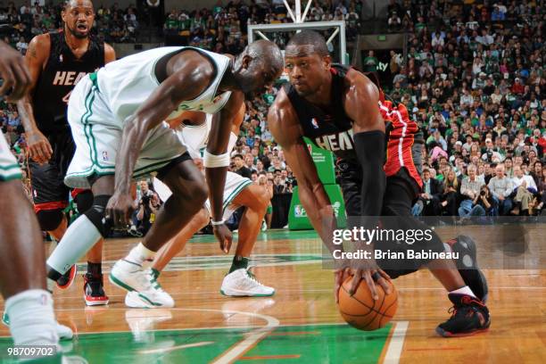 Dwyane Wade of the Miami Heat drives the lane against Kevin Garnett of the Boston Celtics in Game Five of the Eastern Conference Quarterfinals during...