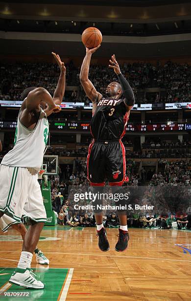 Dwyane Wade of the Miami Heat shoots against Kendrick Perkins of the Boston Celtics in Game Five of the Eastern Conference Quarterfinals during the...