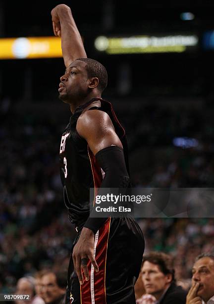Dwyane Wade of the Miami Heat watches his three point shot in the second half against the Boston Celtics during Game Five of the Eastern Conference...